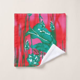 A striking red and green scarf with floral and lea bath towel set
