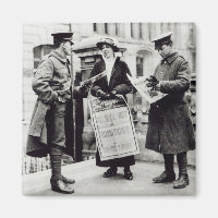 A Suffragette selling newspapers to two