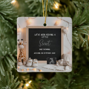 A sweetly sitting giraffe  pregnancy announcement  ceramic ornament