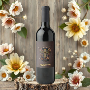 A symbol of strength: The ornate cross with wings. Wine Label