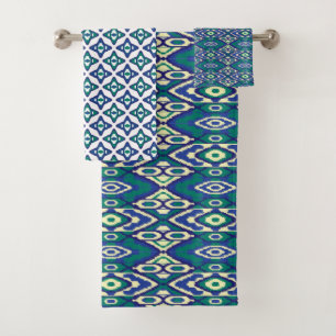 A symmetrical blue and white rug with intricate mo bath towel set