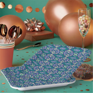 A symmetrical blue and white rug with intricate mo paper plate