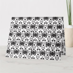 A symmetrical monochrome design featuring intricat card