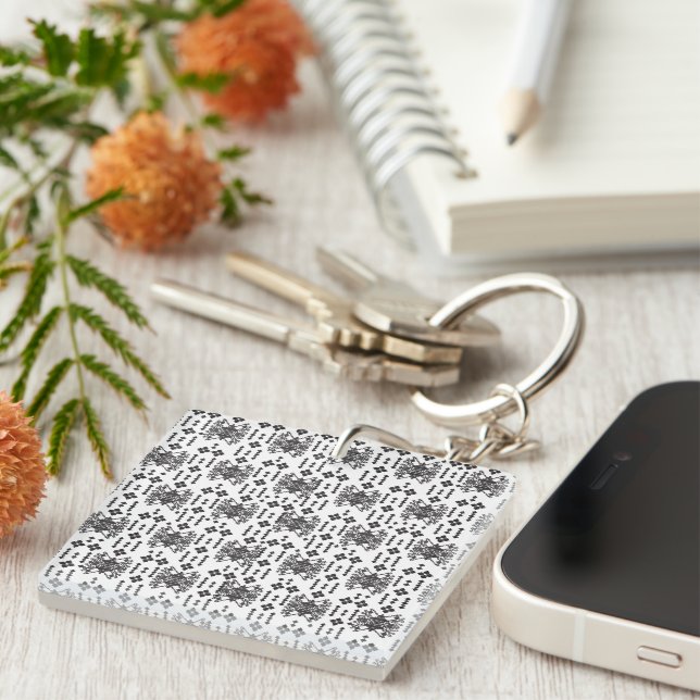 A symmetrical monochrome design featuring intricat keychain (Front Right)