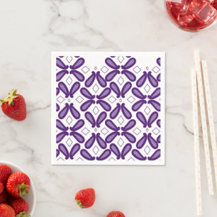 A symmetrical pattern featuring white and purple m napkin