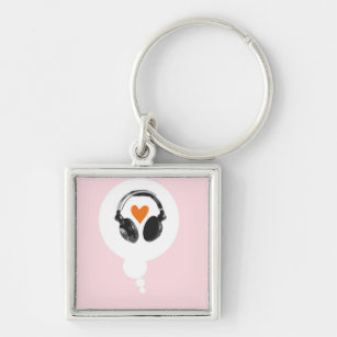 A thought bubble with a heart and headphones keychain