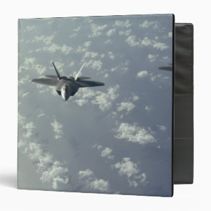 A three-ship formation of F-22 Raptors Binder