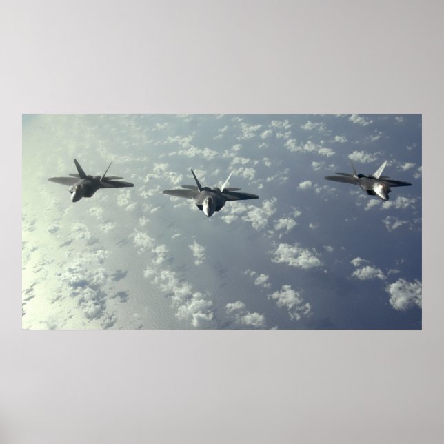 A three-ship formation of F-22 Raptors Poster (Front)