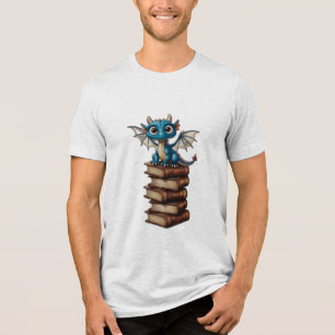 A tiny dragon with oversized eyes, sitting on a st Tri-Blend shirt
