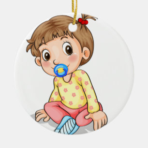 A toddler with a pacifier ceramic ornament