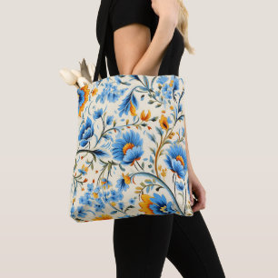 A tote bag with black handles featuring a vibrant