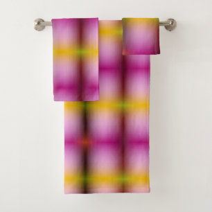 A towel set hangs on a rod featuring a vibrant