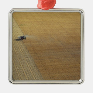 A tractor harvesting metal ornament