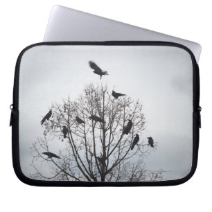 A tree in which many crows have rest laptop sleeve