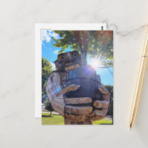 A Troll Holds Up a Tree Postcard