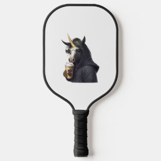 A unicorn with a hoodie drinks a coffee. pickleball paddle