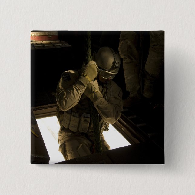 A US Air Force pararescueman begins his descent 2 Inch Square Button (Front)