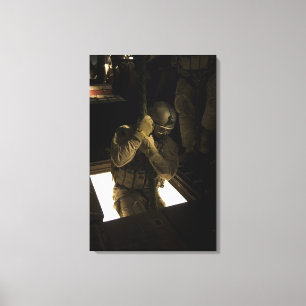 A US Air Force pararescueman begins his descent Canvas Print