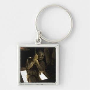 A US Air Force pararescueman begins his descent Keychain