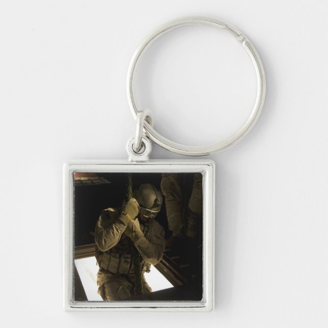 A US Air Force pararescueman begins his descent Keychain (Front)