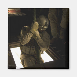 A US Air Force pararescueman begins his descent Magnet