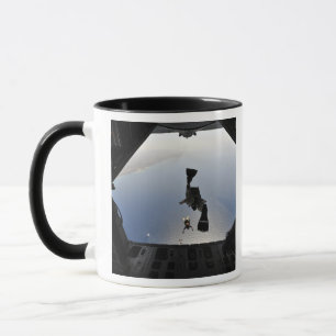 A US Air Force pararescueman jumping out Mug