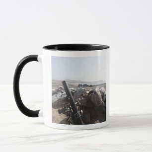 A US Marine fires a mortar in Salinas, Peru Mug