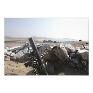 A US Marine fires a mortar in Salinas, Peru Photo Print