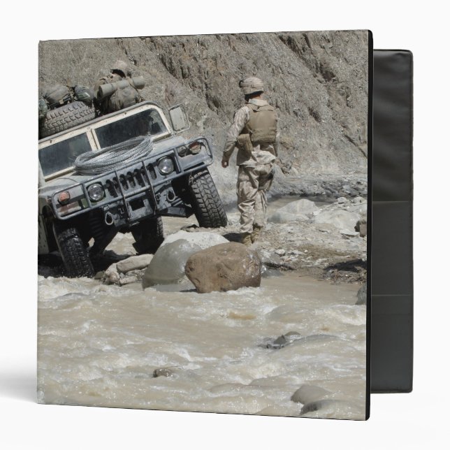 A US Marine guiding the driver of a Humvee Binder (Front/Inside)