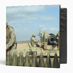 A US Marine prepares howitzer rounds to be fire Binder