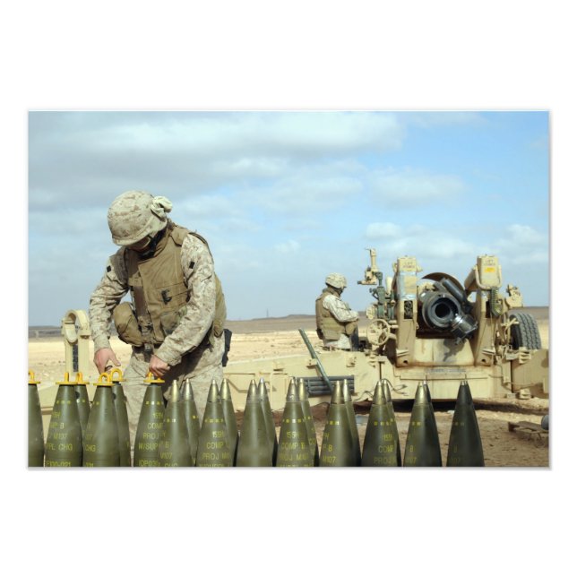 A US Marine prepares howitzer rounds to be fire Photo Print (Front)