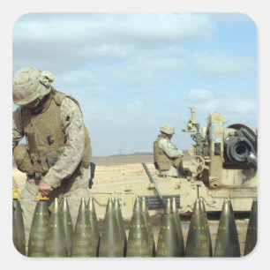 A US Marine prepares howitzer rounds to be fire Square Sticker