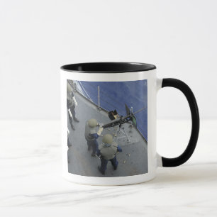 A US Sailor fires a 50-calibre M2HB Mug