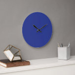 A vibrant blue backdrop with a clean white square  large clock<br><div class="desc">This modern and chic design features a vibrant blue backdrop with a clean white square positioned centrally,  creating a sense of simplicity and clarity. The contrasting colours are eye-catching and sleek,  making it a perfect addition to any minimalist-inspired space.</div>
