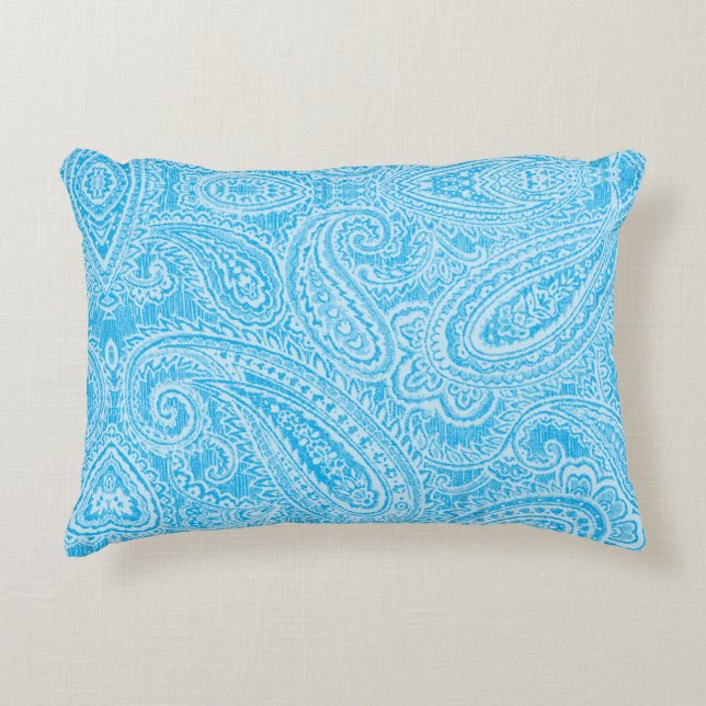 A vibrant blue fabric featuring intricate patterns accent pillow (Front)