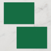 A vibrant green leaf with distinct veins is illumi