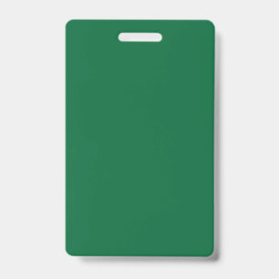 A vibrant green leaf with distinct veins is illumi badge