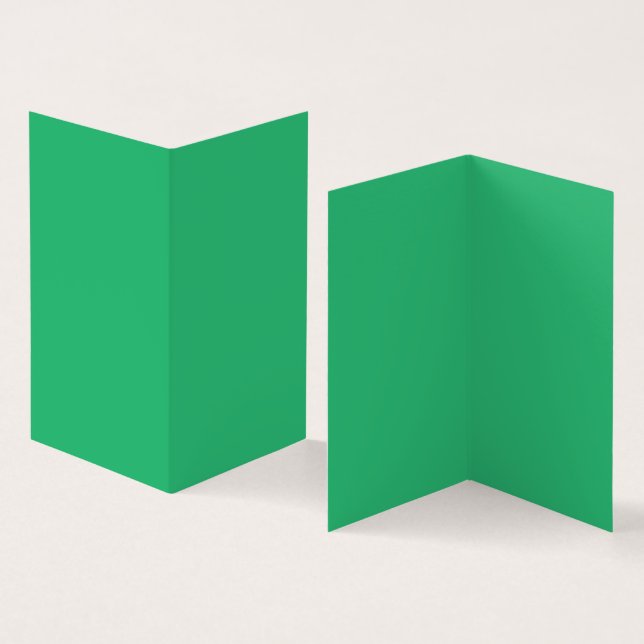 A vibrant green leaf with prominent veins and a de (Inside and Outside)