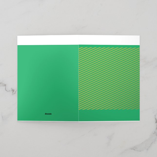 A vibrant green leaf with prominent veins and a de foil greeting card (Outside Laydown)