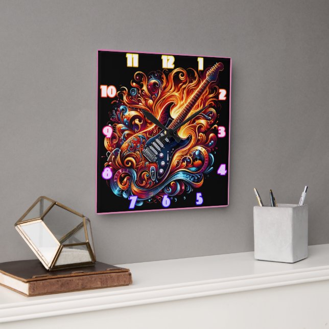 A vibrant guitar surrounded by swirling flames square wall clock (Office)