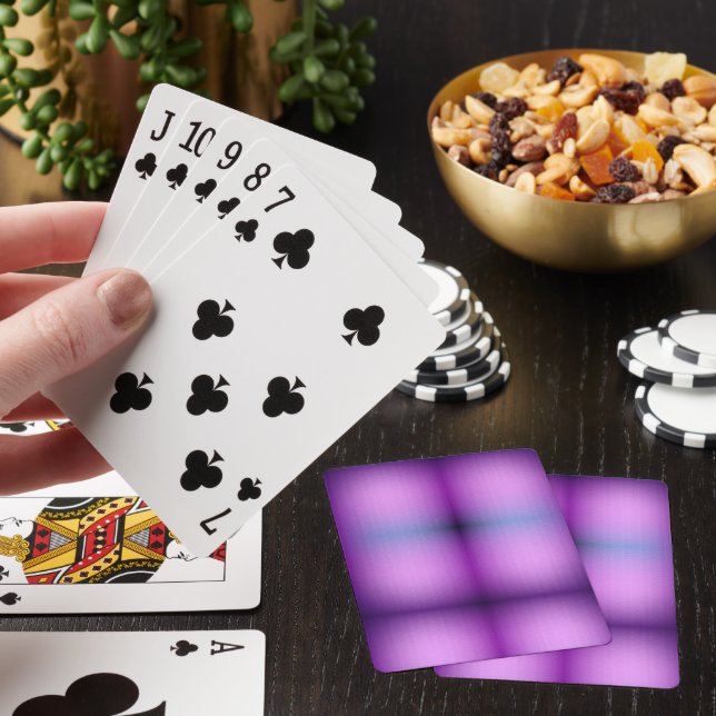 A vibrant purple playing card with a blurred (In Situ)