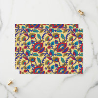 A vibrant textile art piece featuring bold red, ye