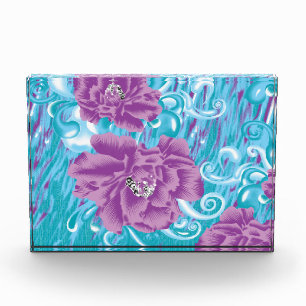 A vibrant textile design featuring purple and turq photo block