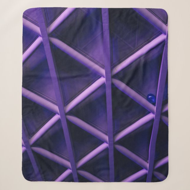 A violet ceiling with a criss-cross pattern; a blu sherpa blanket (Front)