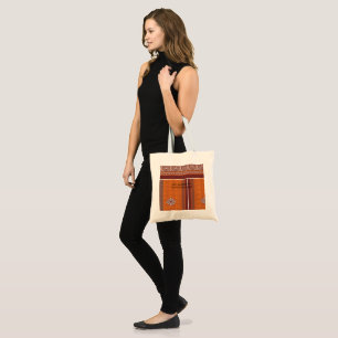 A visually striking pattern combining orange and b tote bag