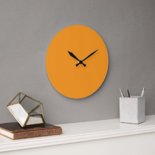 A vivid orange square surrounded by a white border large clock