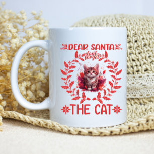 A whimsical holiday plea from a playful kitten coffee mug