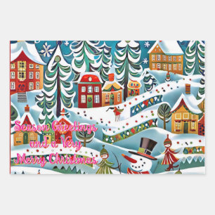 A whimsical winter scene features a lively village wrapping paper sheet