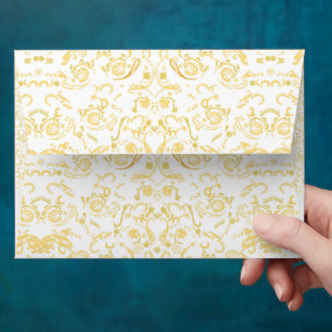 a white and gold wallpaper with a pattern on it envelope