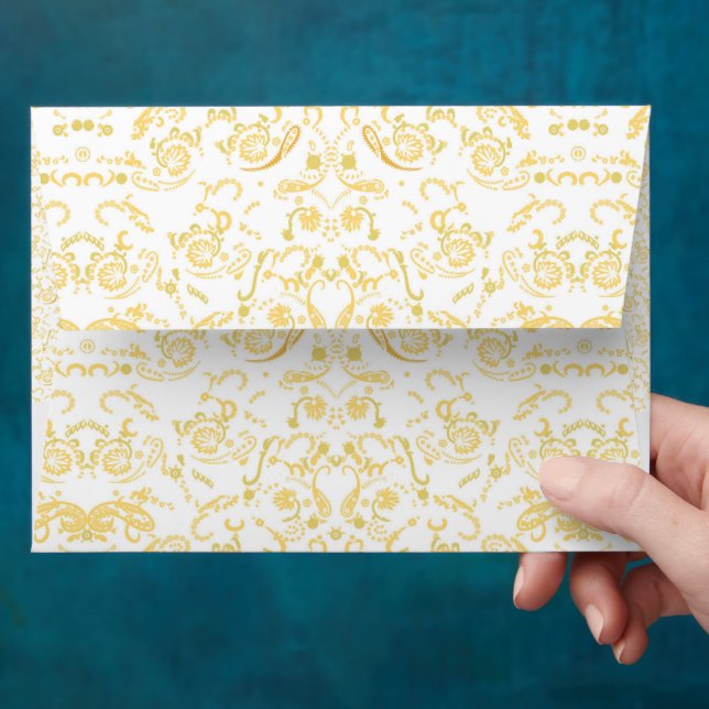 a white and gold wallpaper with a pattern on it envelope (Hand)
